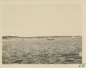 Image of Community with large building and pier, from water